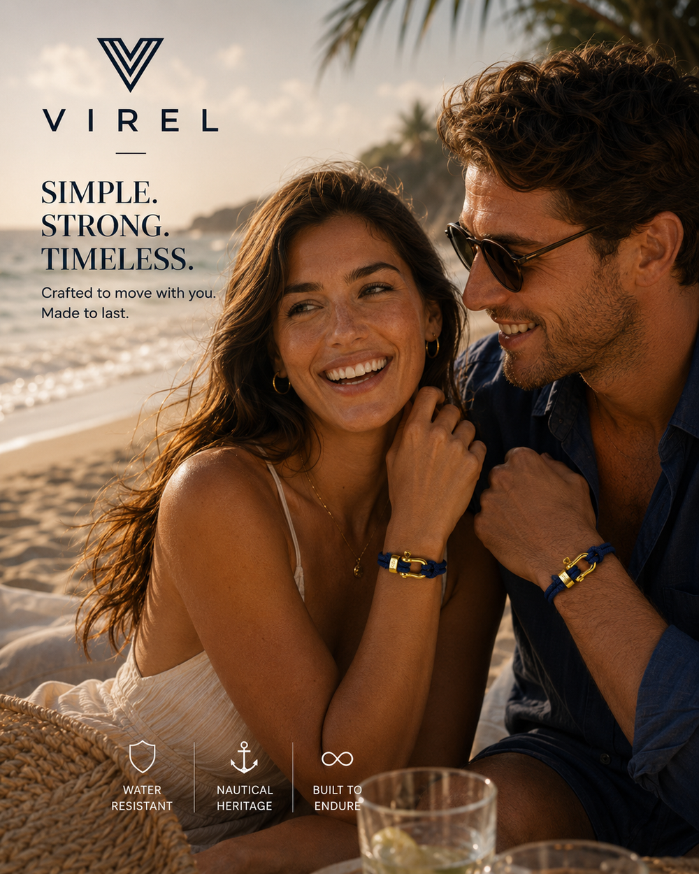 A couple on a sunlit beach, both wearing VIREL rope bracelets